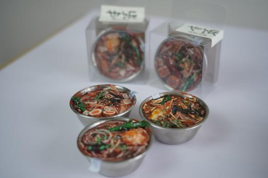 Young amateur creates clay miniature of Luosifen