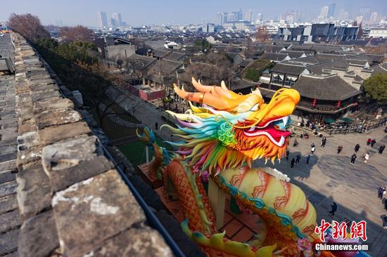 Festive lanterns shine on city wall